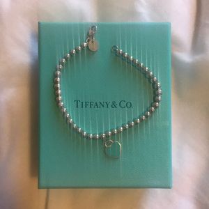 Tiffany ball bracelet with blue heart charm